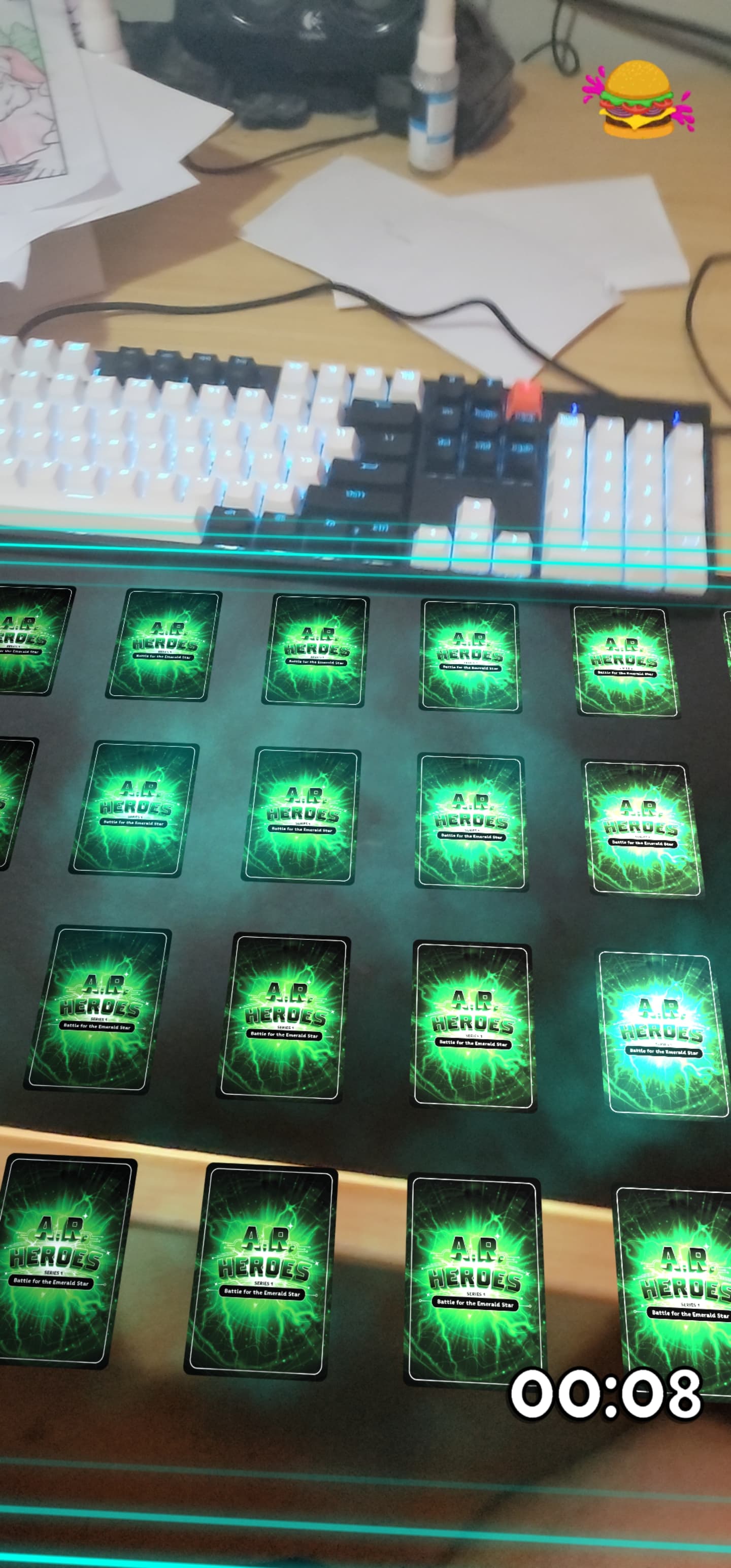 Screenshot of the AR Heroes branded version of the Memory Card game in AR. The players desk and keyboard can be seen in the frame. No cards are flipped
